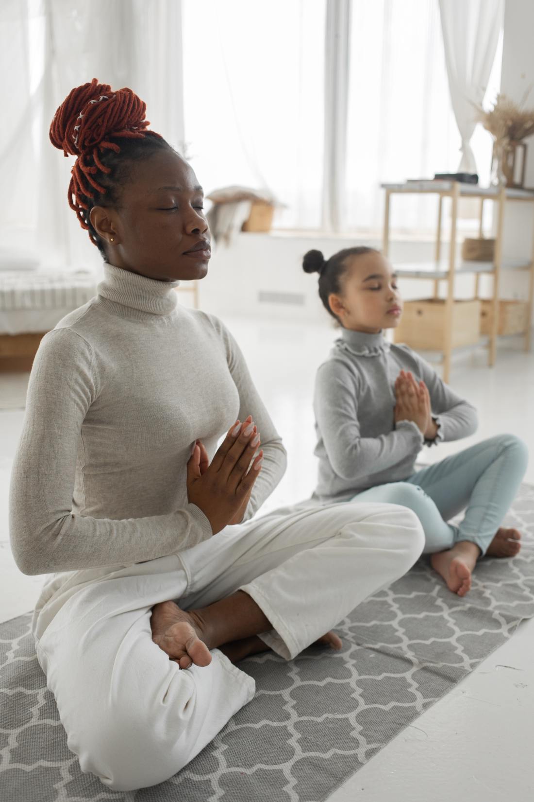 meditating woman and a girl