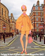 Twiggy wearing a cape